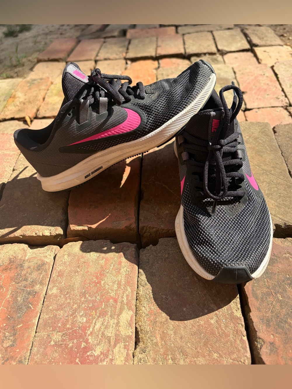 Nike Women's Black Athletic Sneakers with Pink Swoosh